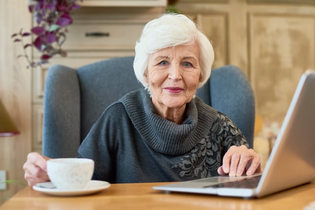 Smiling_Senior_Woman_Using_Laptop_original_601912