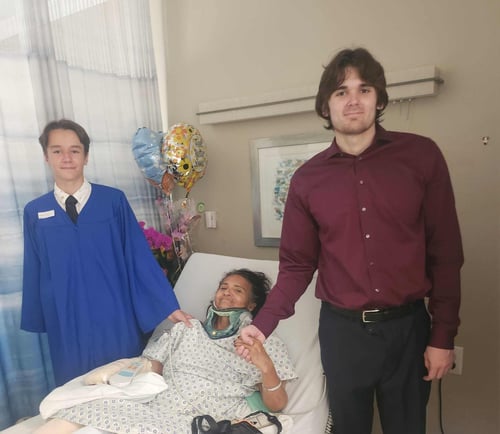 Mom with grandsons at the hospital after the accident